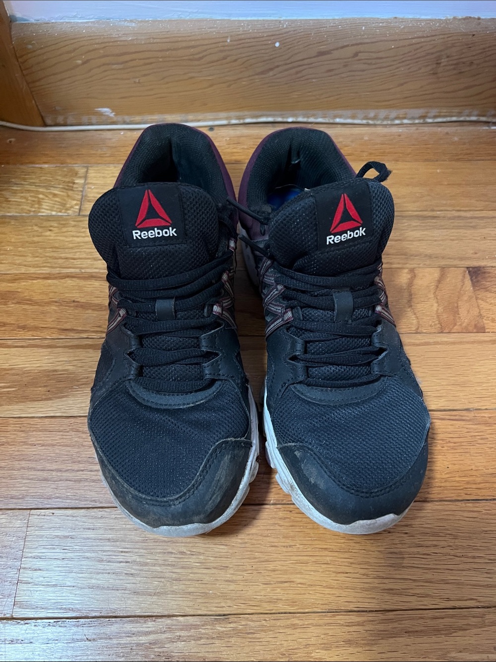 Reebok Black Athletic Sneakers with Red Logo Accents